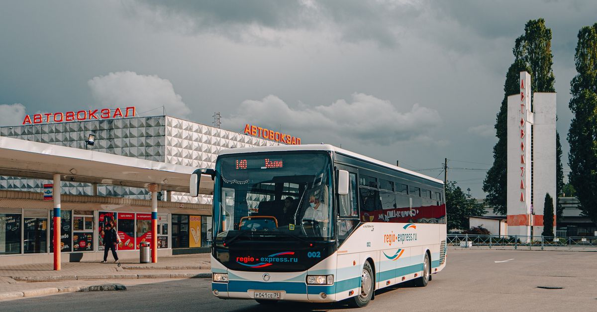 Long-distance coach parked at a regional bus terminal in Argentina